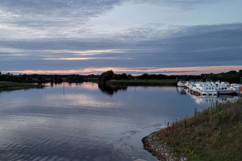Cruising past some boats moored on the lower Shannon