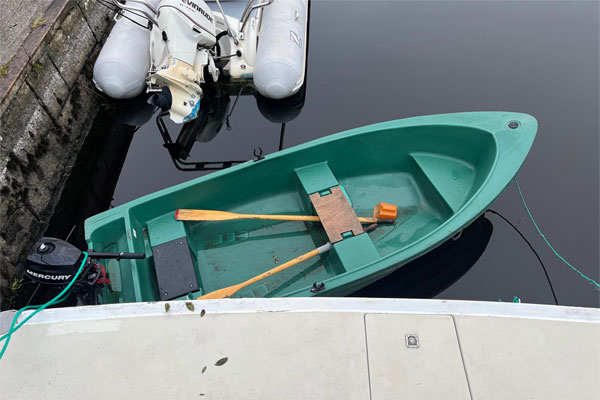 Emerald Star dinghy with outboard.