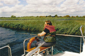 Ines Rudolph fishing from the back of the Lake Star as they make their way downriver.