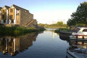 Moored beside riverside apartments