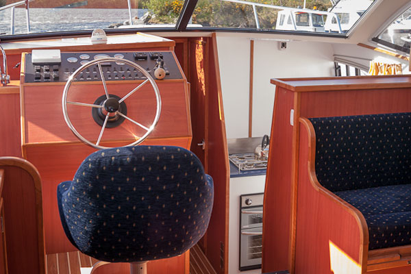 The Helm on the Inver Empress Hire Cruiser