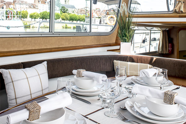 Table set for lunch in the saloon of the P1020 Penichette - hire on Shannon River