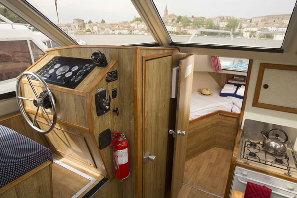 Inside steering and front cabin on the Lake Star cruiser'