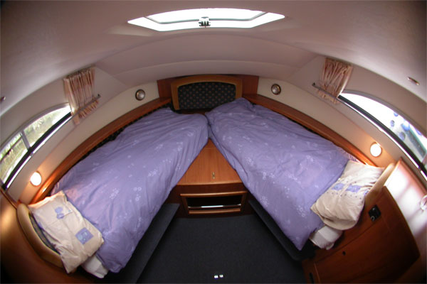 The forward cabin on the Wexford Class cruiser set up as two single beds.