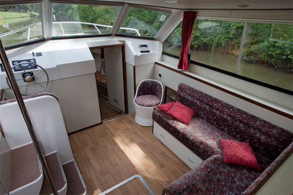 Helm on the Corvette Boat for hire on the Shannon River Ireland