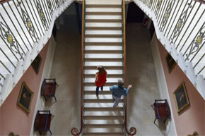 Climbing the stairs at Castle Coole